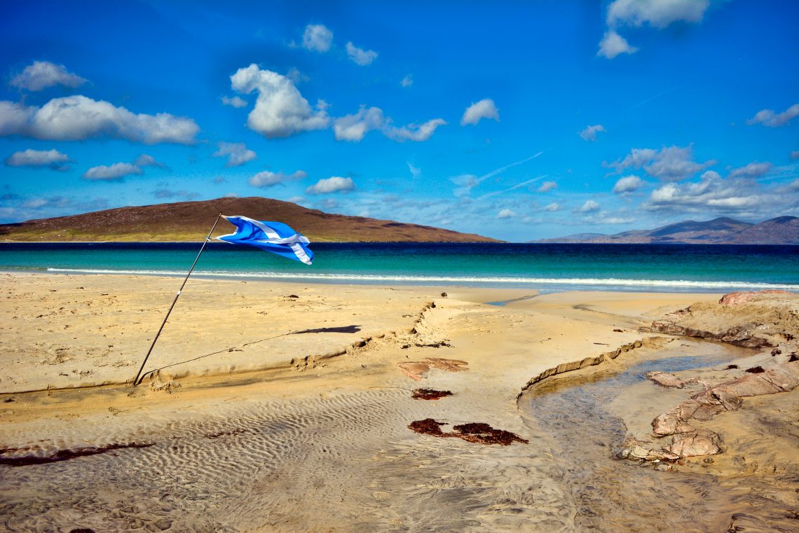 Scottish flag on a beach in a country divided